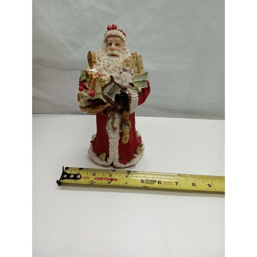 Santa Figurine  ceramic‎ holding gifts appox 9x5x5